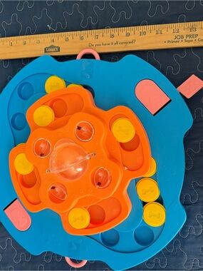 Pet toy: Pop-and-Sort Stackable Puzzle Toy hides treat and pet seeks them.